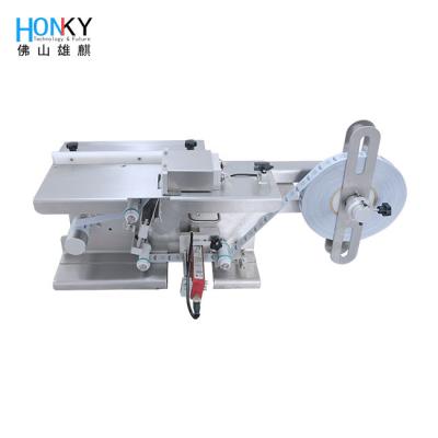 China Manual Small Box Corner Labeling Machine With Transparent Label Sensor For Transparaent Label Box for sale