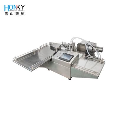 Chine Bouteille ronde de 30 ml Machine de remplissage de liquide au sommet de table Semi-automatique avec pompe à piston en céramique pour remplissage de liquide à vendre