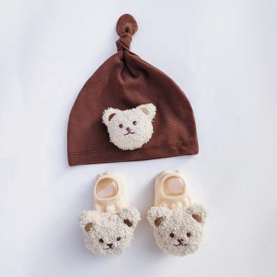 China New Picture Style Soft and Comfortable 0-12 Months 2 Pcs Set Teddy Bear Baby Hat and Elastic Newborn Socks Set for sale