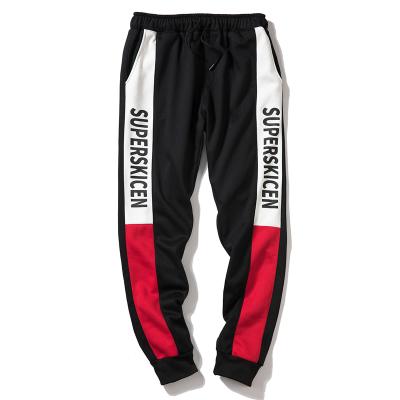 China Anti-Static Mens Polyester Jogger For Gym Training Fitness And Sweatpants Black Jogger Pants For Men for sale