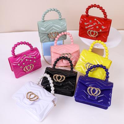 China PVC cartera para para ninas little girl clips PVC beads handle and removable metal tie women's mini bags for sale