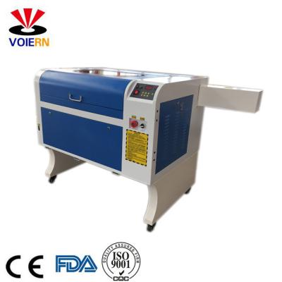 China Liaocheng xuanzun low price CO2 leather laser engraving/acrylic wood glass and dog tag laser cutting machine 4060 50W 60W 80W for sale