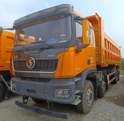 China 31-40t Delong X5000 8X4 dumptruck met banden en koolstofstaal Te koop