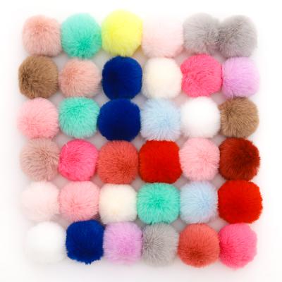 China Christmas Pompoms Decoration Super Soft Loose Colorful Fluffy Fur Ball Key Chain Pendant for sale