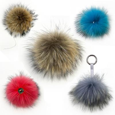 China Factory Hot Selling 13cm Bulk Raccoon Pompom Soft Hand Feeling With Rope Pom Poms Detachable Fluffy Real Raccoon Fur Ball Trim Skullcaps for sale