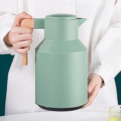 China Sustainable New Design 1L Double Wall Insulated Glass Vacuum Water Kettle, Hot Water Coffee Tea Water Pot With Wooden Handle for sale