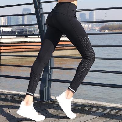 China Antibacterial Yoga Pants Hollow High Waist Sports Fitness Women Running Yoga Gaiters Tights for sale