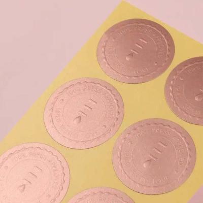 China Waterproof Rose Gold Foil 30mm Series Embossed Label Embossed Sticker Printing for sale