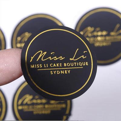 China Waterproof Metallic Gold Foil Hot Stamping Round Sticker Custom Printed Logo Adhesive Stickers for sale