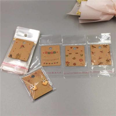 China Brand Logo Paper Cmyk Printing Brown Kraft Paper Earring Cards With Package PVC Plastic Bag for sale