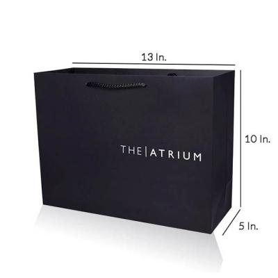 China Recyclable Luxury Black Matte Gold Logo Printed Shopping Paper Bag For Garment Packaging for sale