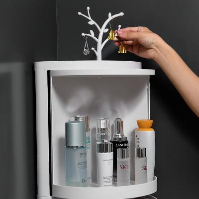 China 2020 Minimalism Cosmetic Storage Box Bathroom Sink Dust Corner Cabinet Bathroom Rotate LED Light Hot Selling Free Punch Cosmetic Case for sale