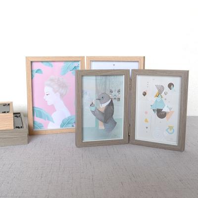 China Creative simple plain creative folding photo frame decorative folding photo frame wooden cavity 6/7 inch frame for sale