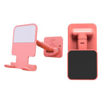 China Mini Mobile Wall Cell Phone Adjustable Universal Custom Adhesive Plastic Holder For Wall Mount for sale