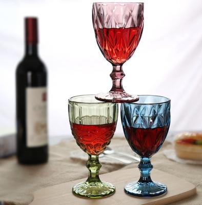 China CREATIVE Wholesale Vintage Wine Glass Wedding Decoration Wine Cup Colored Embossed Glassware Glass Goblet for sale