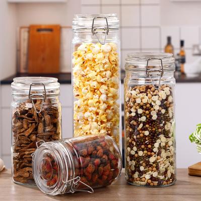 China Eco-friendly Freshness Preservation Sealed Nut Airtight Preservation Containers Hold Glass Candy Jar Containers For Food Storage With Clip Lid for sale