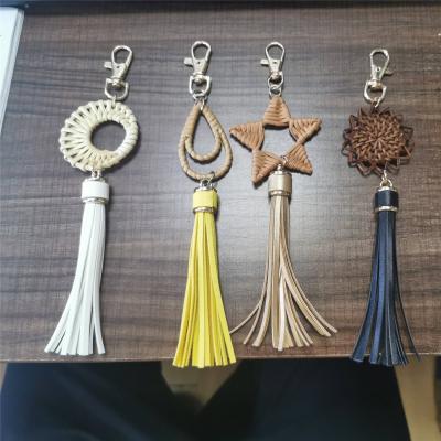 China Promotion gifts wholesale and drop shipping DIY rattan accessories 2021 new character design PU rattan tassel handmade woven leather keychains for sale