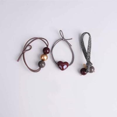 China Fashion Girl Band Knotted Rope Head Bead Tied Hair And Soft Elastic Band Lady Hair Circle Set Combination Hair Flips With Balls for sale