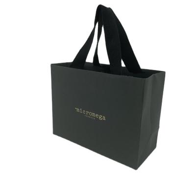 China Recycled Materials Wholesale Custom Gold Stamp Printed Black Luxury Gift Newsboy Shopping Bag With Strap Handle for sale