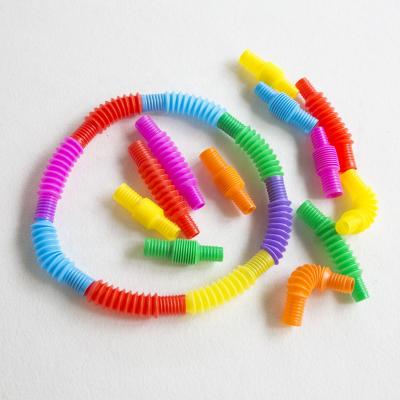 China Kids Fun Pull Noise Eco-friendly Material Tubes Stretch Bend Construction Connect Game Toy Provide Tactile Auditory Sensory Colorful for sale