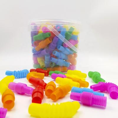 China 100pcs mini amazon funny tube sensory adhd pipe kids jumpy person toy pop up tube set for sale