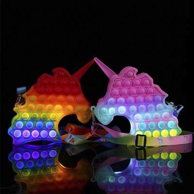 China Reduce Stress 2021 Kid Christmas Gift With LED Light Silicone Unicorn Jumping Lightning He Wiggle Bag for sale