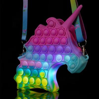 China Reduce Stress 2021 Kid Christmas Gift With LED Light Dropshipping Silicone Unicorn Jumping Lightning He Wiggle Bag for sale