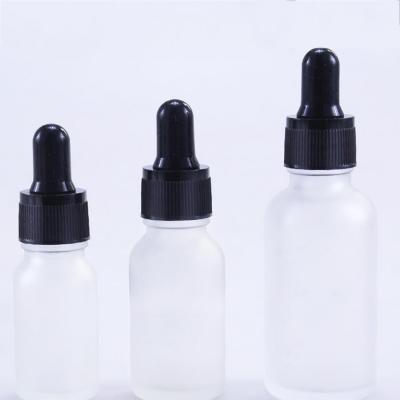 China essential oil 30ml frosted and clear glass bottle for essential oil with bamboo lid dropper bottle for sale