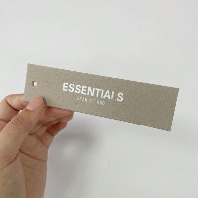 China New Brand Viable Custom Hang Tags Printing White Font Swing Tag Fashion Gray Card Clothes Tags With String for sale