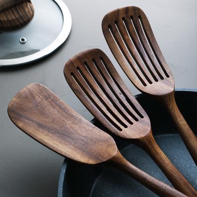 China 33.8cm Teak Solid Kitchen Wooden Utensils Heat Resistant Non Stick Pan Spatula for sale