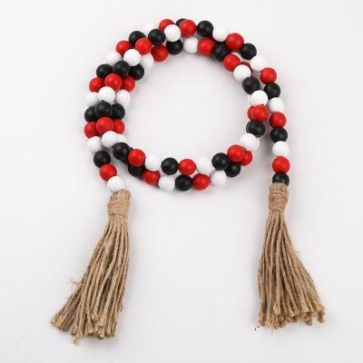 China Glamorous Black and White Red Hollywood Beads Halloween Wood Ornaments Wooden Bead Garland with Tassel or Tag for Home Decor for sale