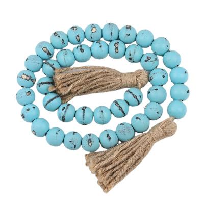 China Art Deco Fashion Blue Wooden Bead Garland Handmade Cotton Tassels Wooden Beaded String Home Decor for sale