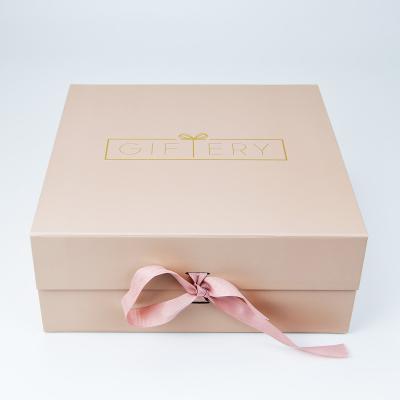 China Custom Recycled Materials Logo Collapsible Pink Rigid Cardboard Packaging Magnetic Paper Gift Box With Pink Ribbon Closure for sale