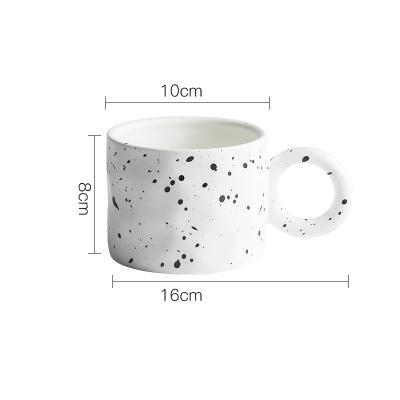 China Statistical Viable Style Coffee Mug Ceramic Ink Splattered Irregular Hand Pinch Ceramic Mug With Big Ears for sale