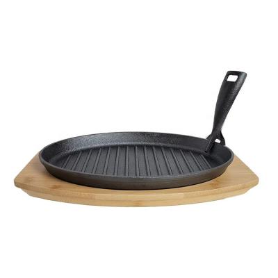 China Amazon Hot Plate Durable Oval Cast Iron Steak Sizzling Dish Set With Wood Base for sale