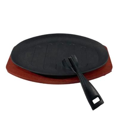 China Amazon Home Kitchen Durable Cast Iron Sizzling Pan Fajita Pans Non-Stick Sizzling Dish With Wooden Base for sale