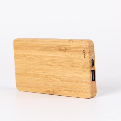 China Convenient Ultra Thin Custom Wooden Logo Power Bank Design 8000mA Power Bank for sale