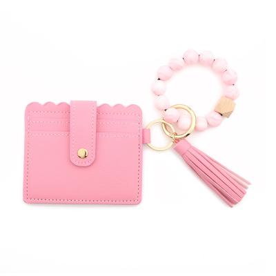 China Hot Selling Cute Silicone Beads Leather Key Ring Wristband Key Chain PU Tassel Keychain Wristband Bracelet for sale