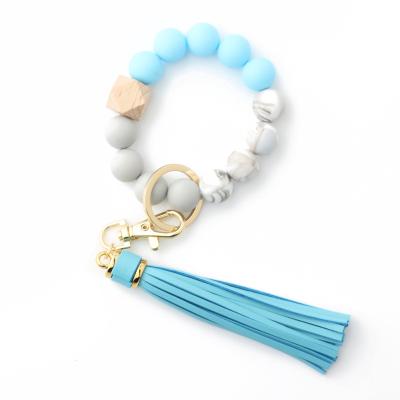 China Newest Cute Customizable Edible Silicone Grade Logo Silicone Key Chain Bracelet Bead Bracelet Bangle Key Chain For Loss Prevent for sale