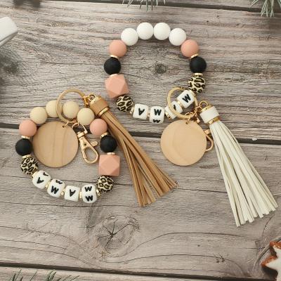 China Cute Summer Prevent Loss Silicone Bead Key Chain Dangling Mom Key Chain Silicon Beads Wrist Key Chain With Wooden Disc for sale