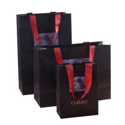 China Recyclable Customize Fashion Fancy Glossy Paper Bag For Recyclable Packaging Bags for sale