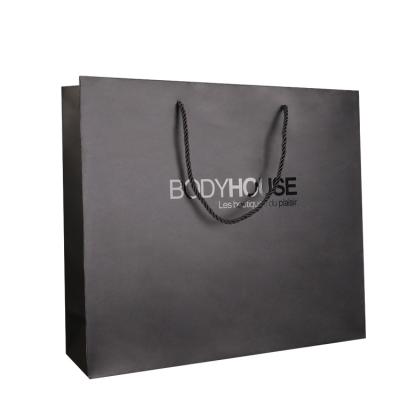 China Recyclable Custom Reinforcing Big Black Paper Bag For T Shirt Boxes Carry Bag for sale