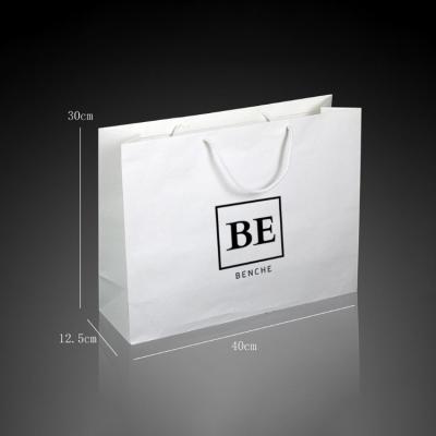 China Recyclable Custom LOGO White Paper Large Strong Bag For Clothing Shopping / Pants / Shoes Carry Bag for sale