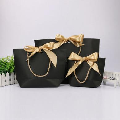 China Wholesale Recyclable Custom Design Pink Gift Bag With Bowknot Ribbon Handle for sale