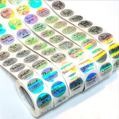 China Custom Logo Sticker Silver Laser Hologram Transparent Waterproof UV Proof Die Cut Holographic Sticker Label for sale