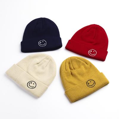 China COMMON multple color knitted hat warm knitted hat winter hats smile embroidery beanie for sale