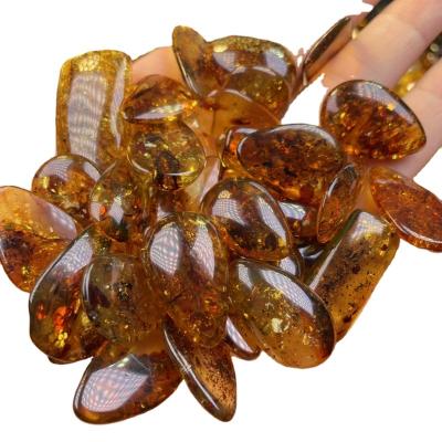 China Religious Amber Baltic Russian Red Natural Amber Design Rare Amber Pendant Can Be Inlaid for sale