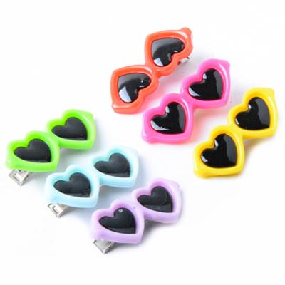 China Sustainable Pet Clothing Accessories Pet Decorative Heart Shaped Sunglasses for sale