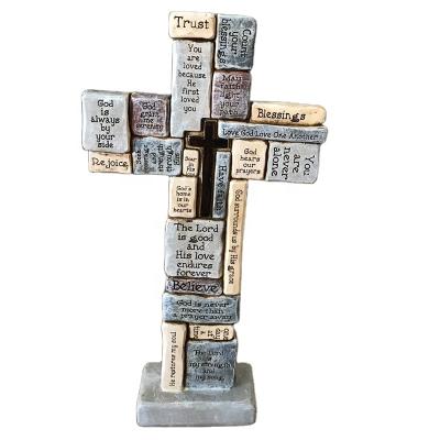 China Europe Nailed Stones Bible Verse Resin Cross Type Religious Stone Cross With Stand for sale