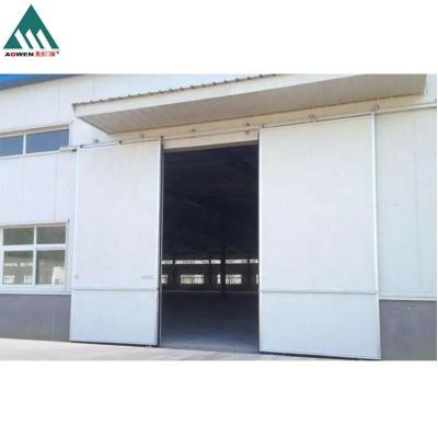 China Thermal insulation best price automatic or manual industrial garage sliding doors for sale